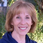 Smiling woman with short blonde hair